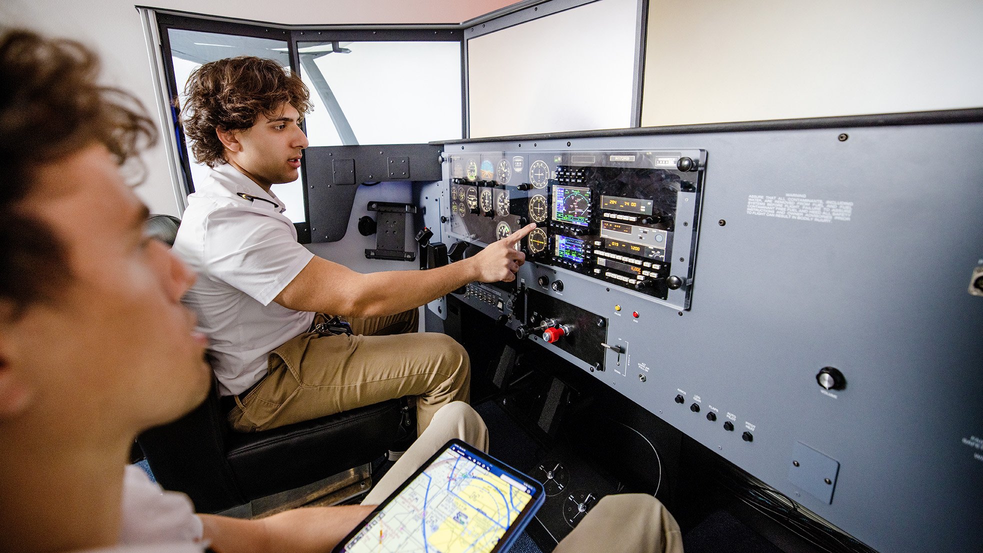 Student and Flight Instructor practicing IFR in a Redbird Simulator