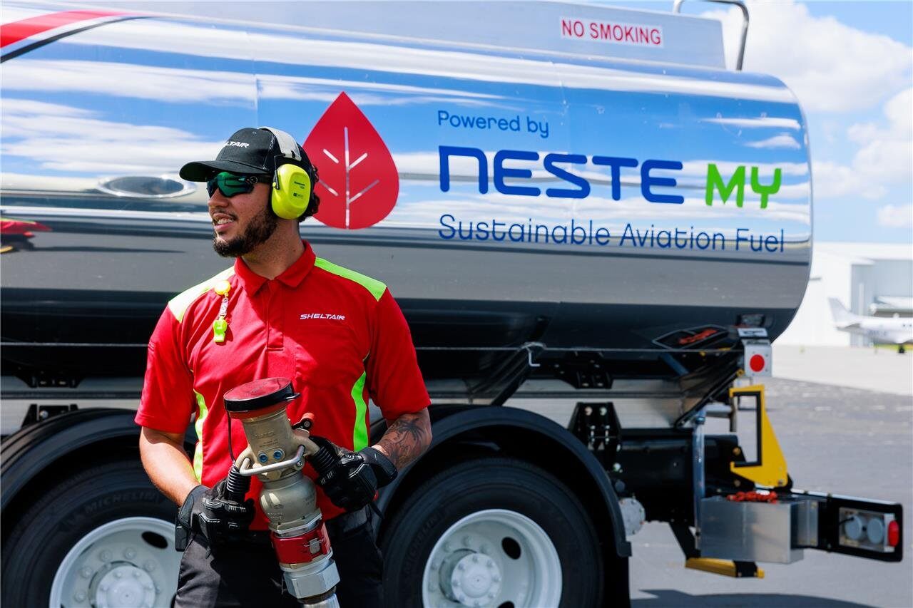 Aircraft fueler in front of a fuel truck. 